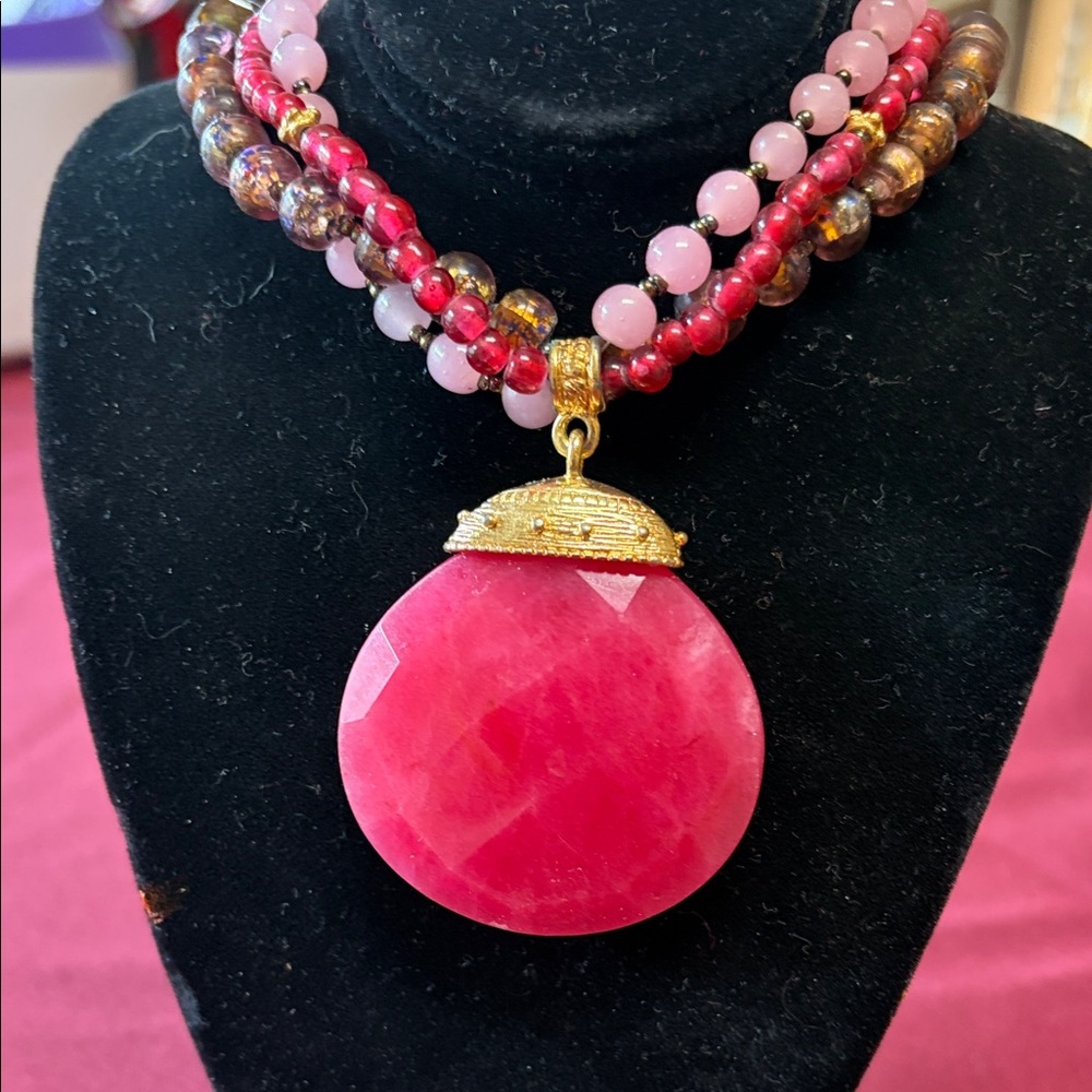 Cherry red pendant on beaded necklace